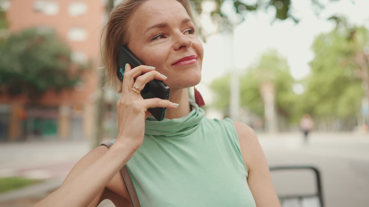 Woman on Phone Checking Time in City