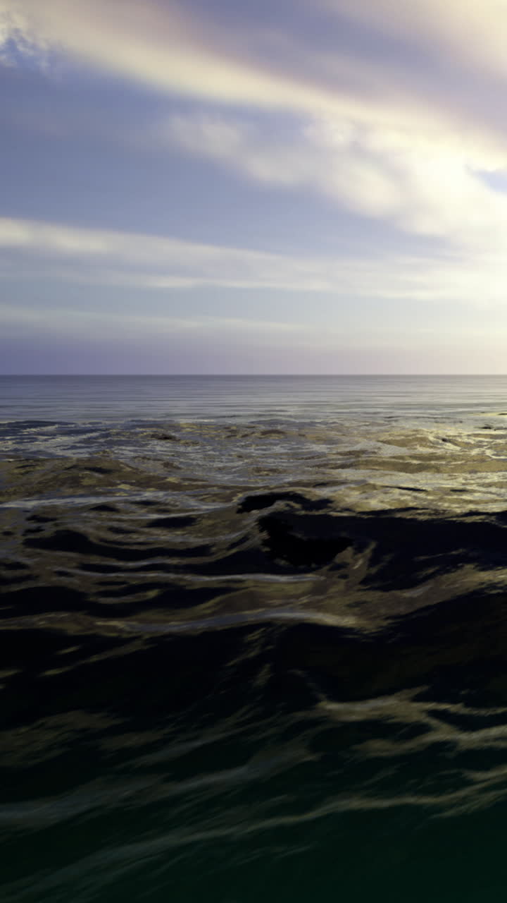 Ocean waves dance under a colorful sky at sunset near the shore