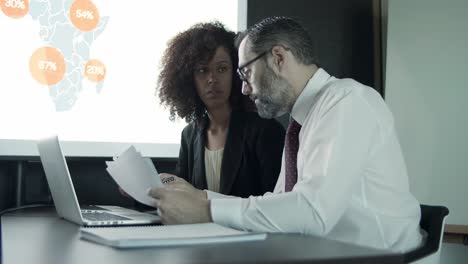 young curly african american assistant talking with boss