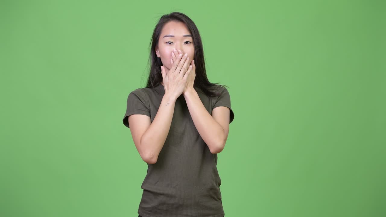 Young beautiful Asian woman showing three wise monkeys concept