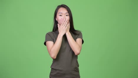 young beautiful asian woman showing three wise monkeys concept