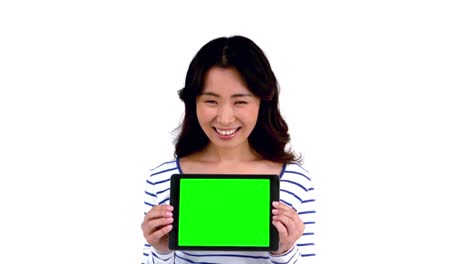 pretty asian woman holding a tablet