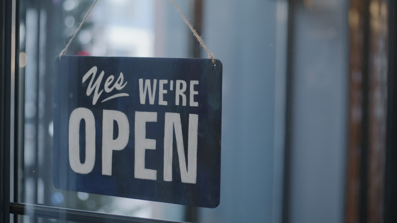 Business Owner Hanging Open Sign