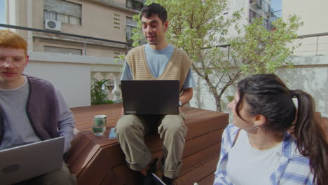 gen z colleagues working outside and discussing ideas
