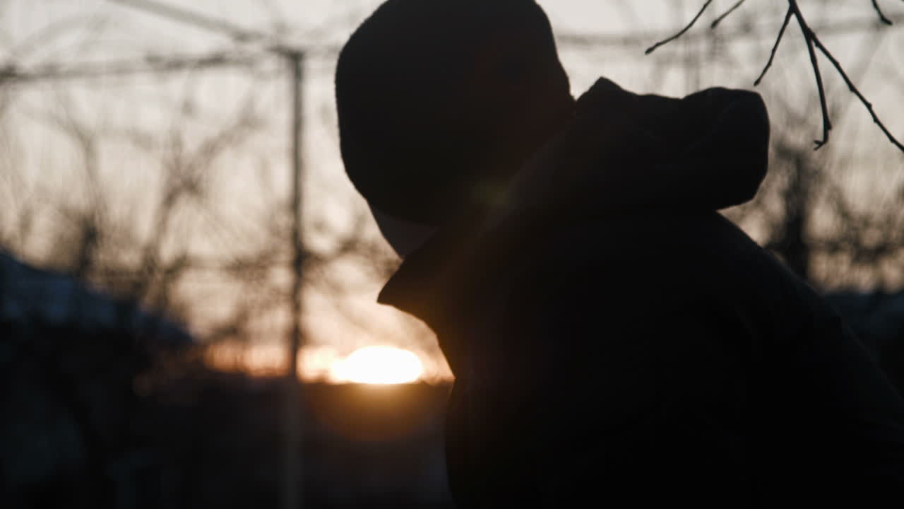 Silhouette Of Man Drink Hot Tea In The Winter (Stock Footage)