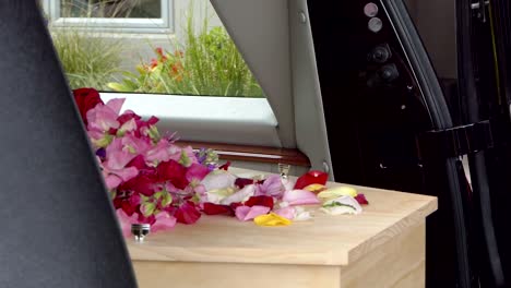 closeup-shot-of-a-funeral-casket-in-a-hearse-or-chapel-or-burial-at-cemetery