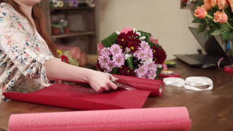 florist wrapping a bouquet