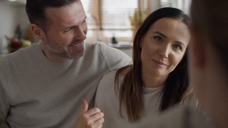 Caucasian-marriage-talking-with-unrecognizable-woman-over-breakfast-together