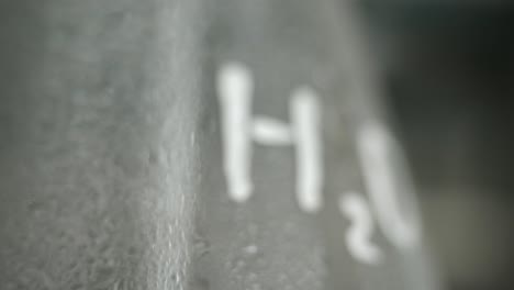 close-up of water molecule (h2o) on a glass flask