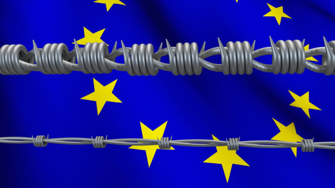 alambre de púas contra la bandera de la ue