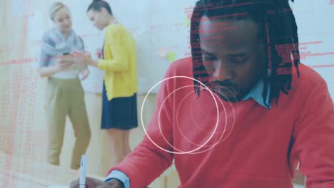 Animation-of-rotating-rings-and-data-processing-over-smiling-african-american-man-in-workplace