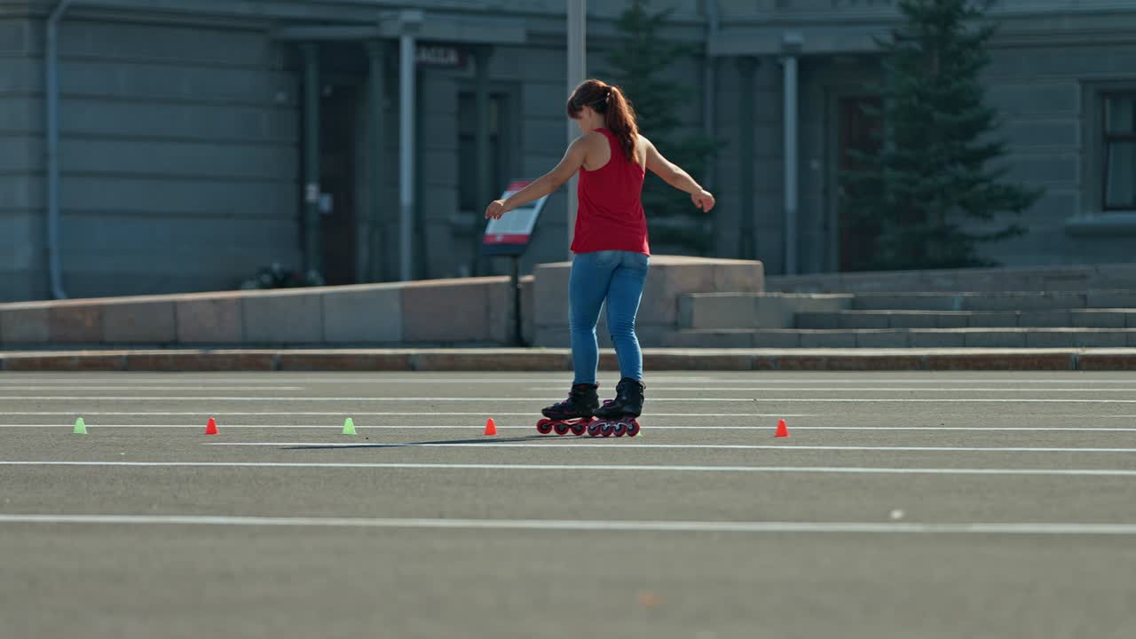 Girl teenager dances on roller skates, slalom, criss-cross. Professional elements on roller skates, training. 4k, 10bit, ProRes
