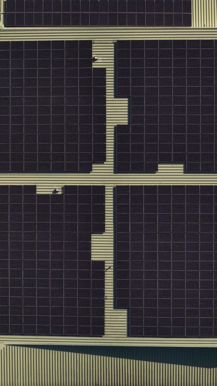 Vertical Top Drone Shot of Solar Panels on Rooftop of Modern Building, Birdseye Aerial View