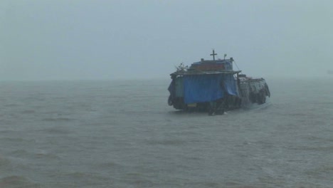 a dilapidated vessel heads out into a heavy storm