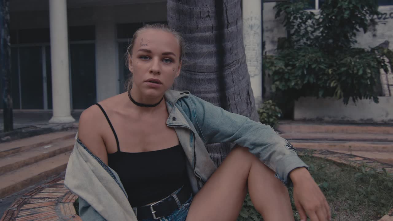 Woman Sitting in an Urban Setting