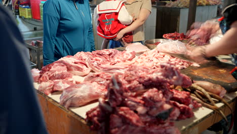 people purchasing meat at the wet market in sapa city, vietnam - close up