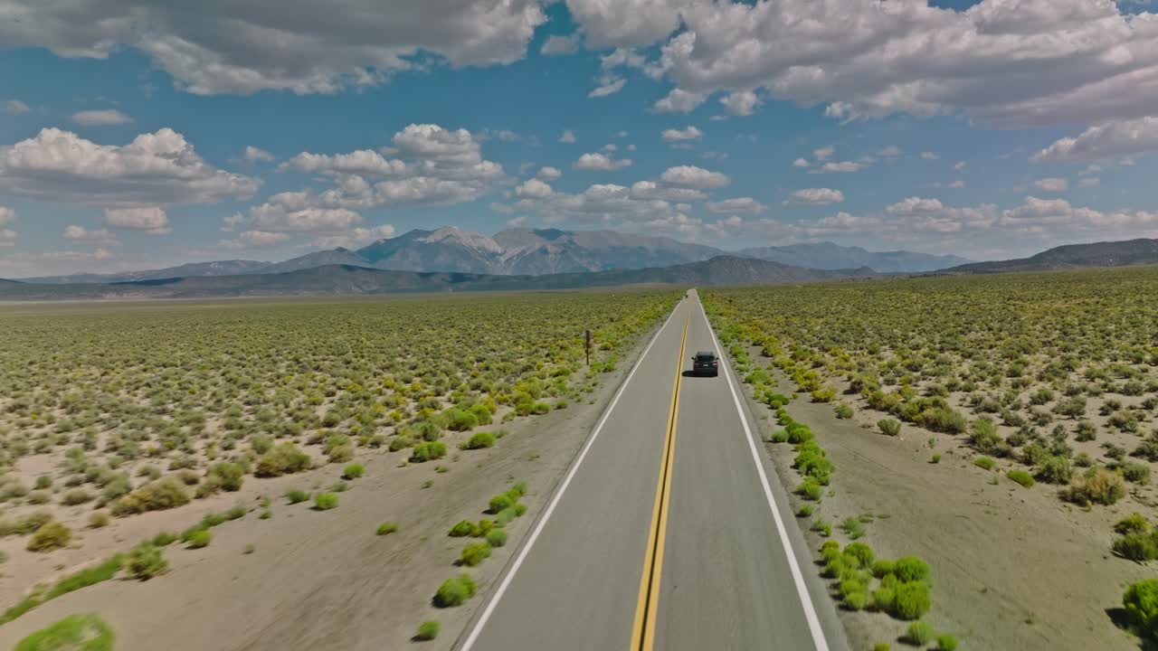 Car driving along a twisting road in the Valley