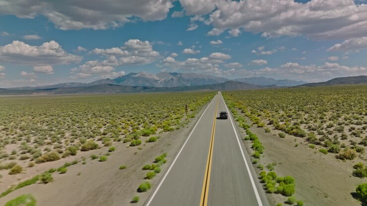 Car driving along a twisting road in the Valley