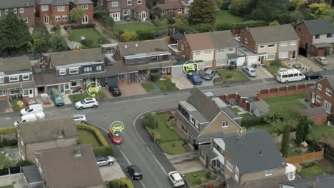 Energy-and-electric-car-graphic-overlay-flashing-over-British-neighbourhood-properties-using-the-technology-aerial-view