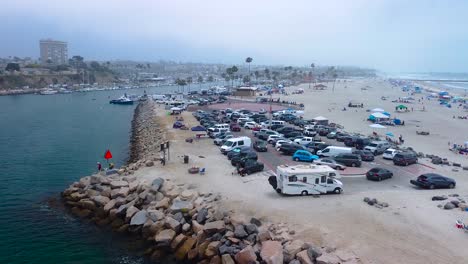 drone shot oceanside harbor from water to big circle