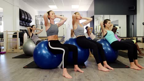 Beautiful-women-exercising-in-fitness-studio