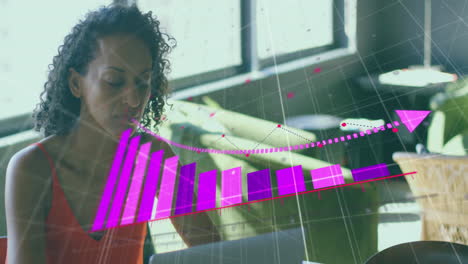 Working on laptop, businesswoman analyzing financial graph animation in office