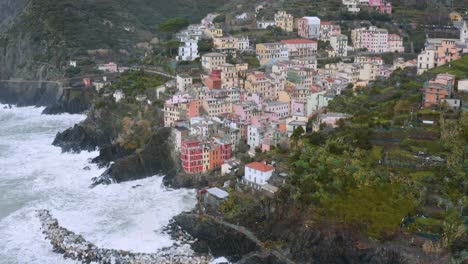 Aerial-view-of-Manarola,-Cinque-Terre,-during-a-sea-storm