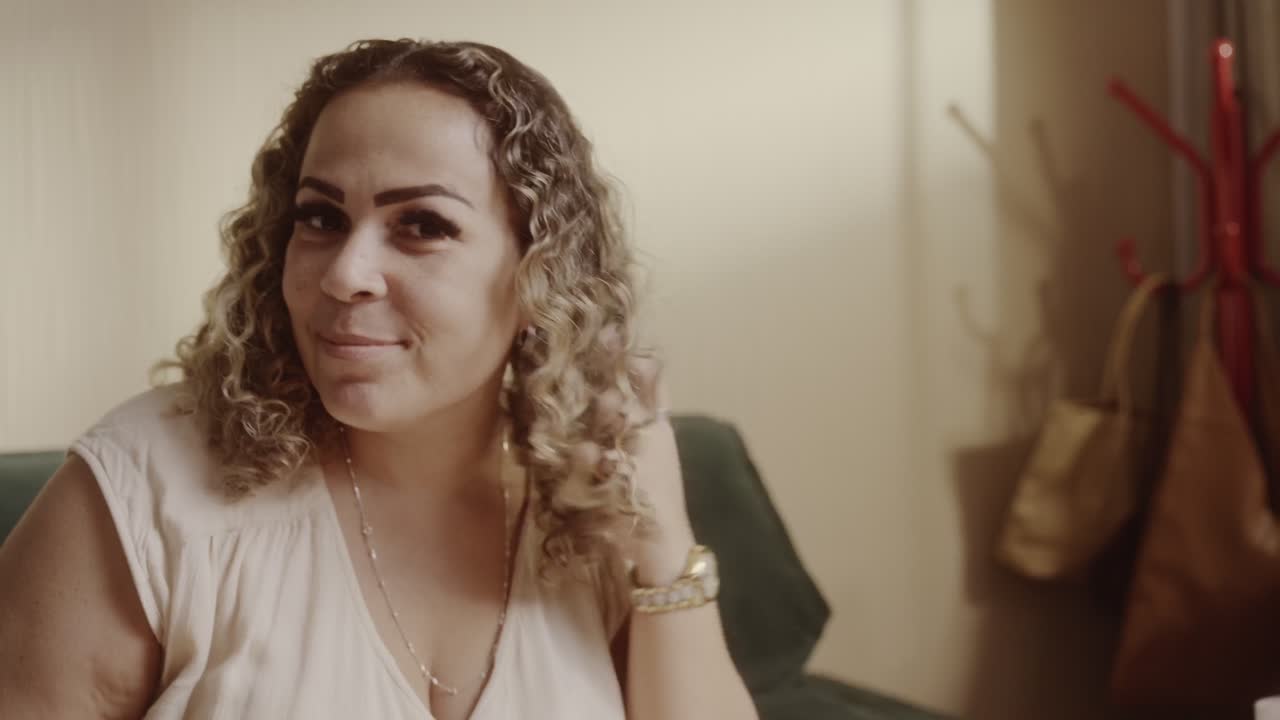 A Smiling Woman with Curly Hair