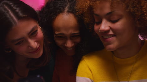 three friends laughing together