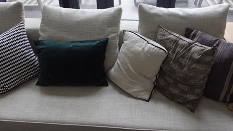 gray sofa with decorative pillows