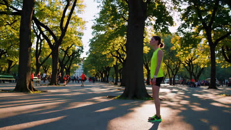 woman stretching and jogging in a park on a sunny day
