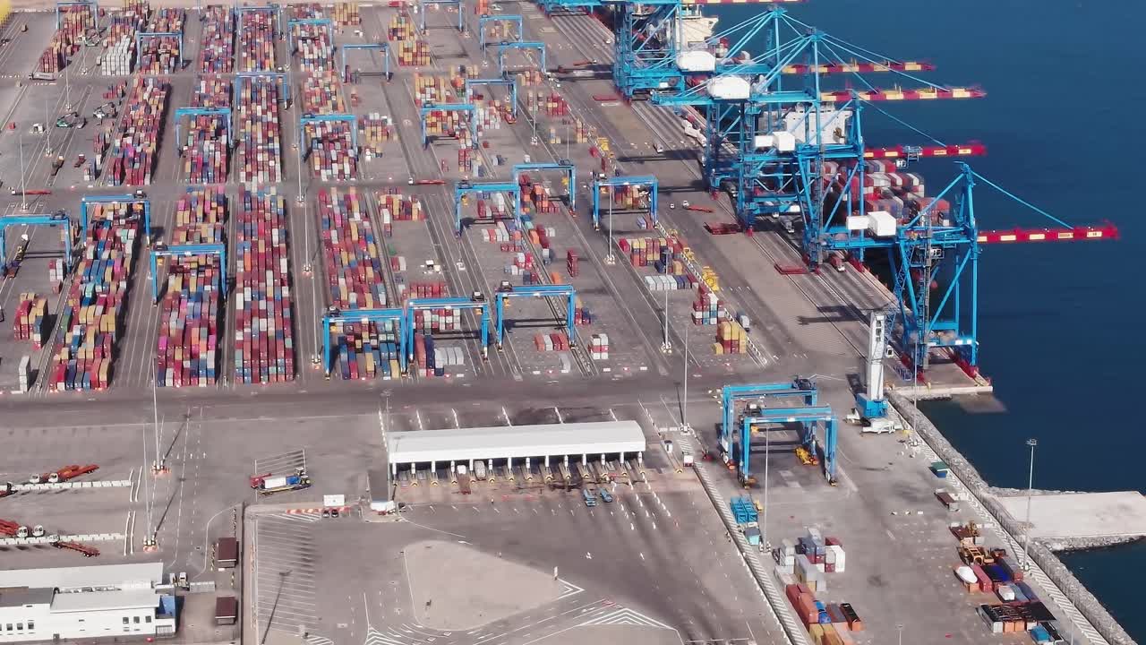 Container terminal in Accra, Ghana with many stacked shipping containers