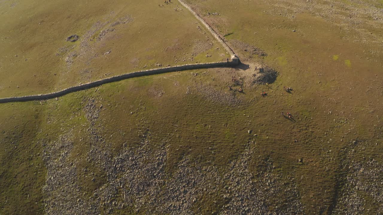 Top down, cinematic shot at Slieve Donard's peak