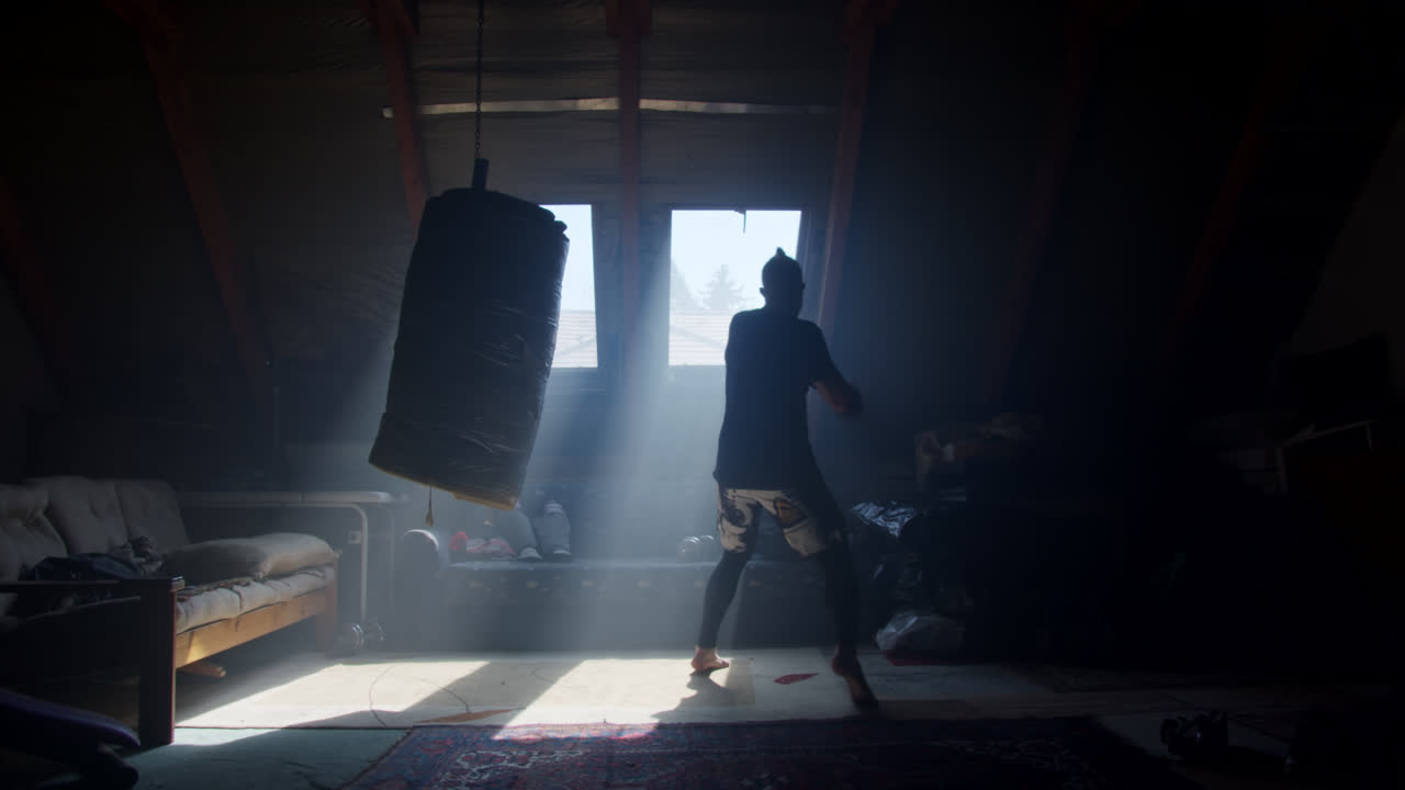 Man training in an attic gym