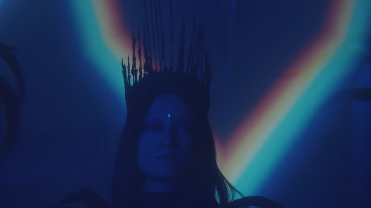 Portrait of Gothic Woman in Crown with Face Gem