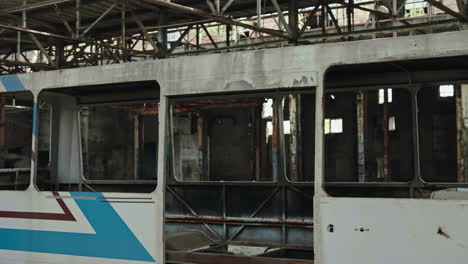 abandoned bus in a ruined factory