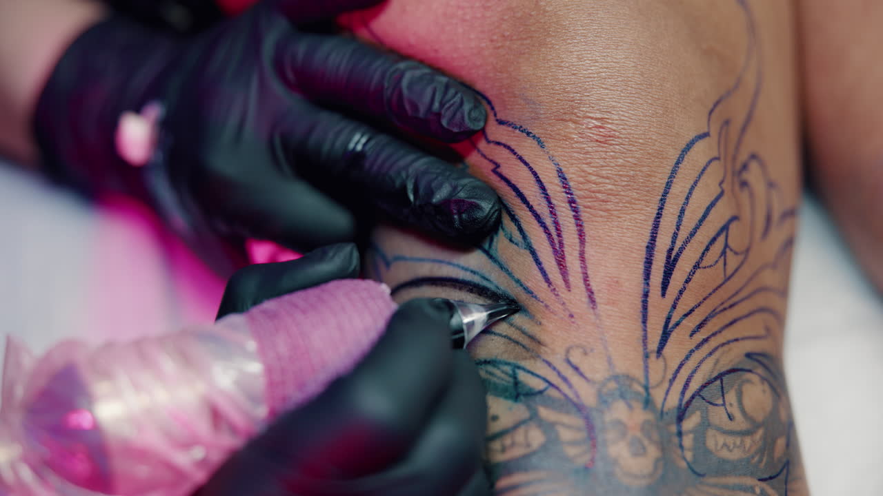 Close-up of a tattoo in progress on a knee