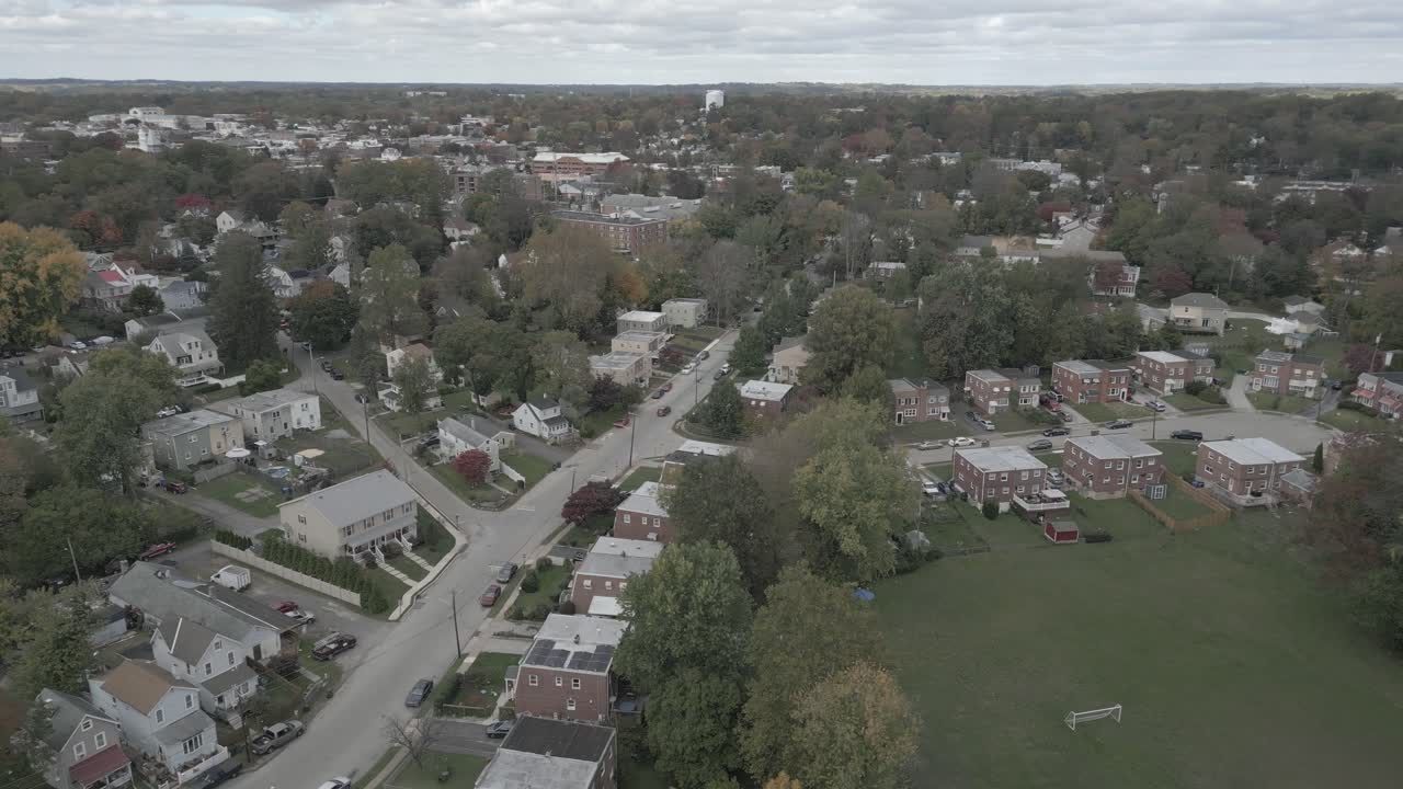 Flying over head of a small town full of buildings