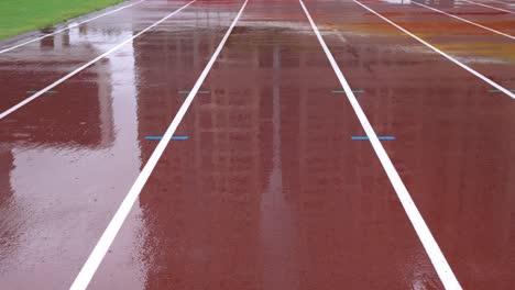 rainy day, athletics track in the stadium.