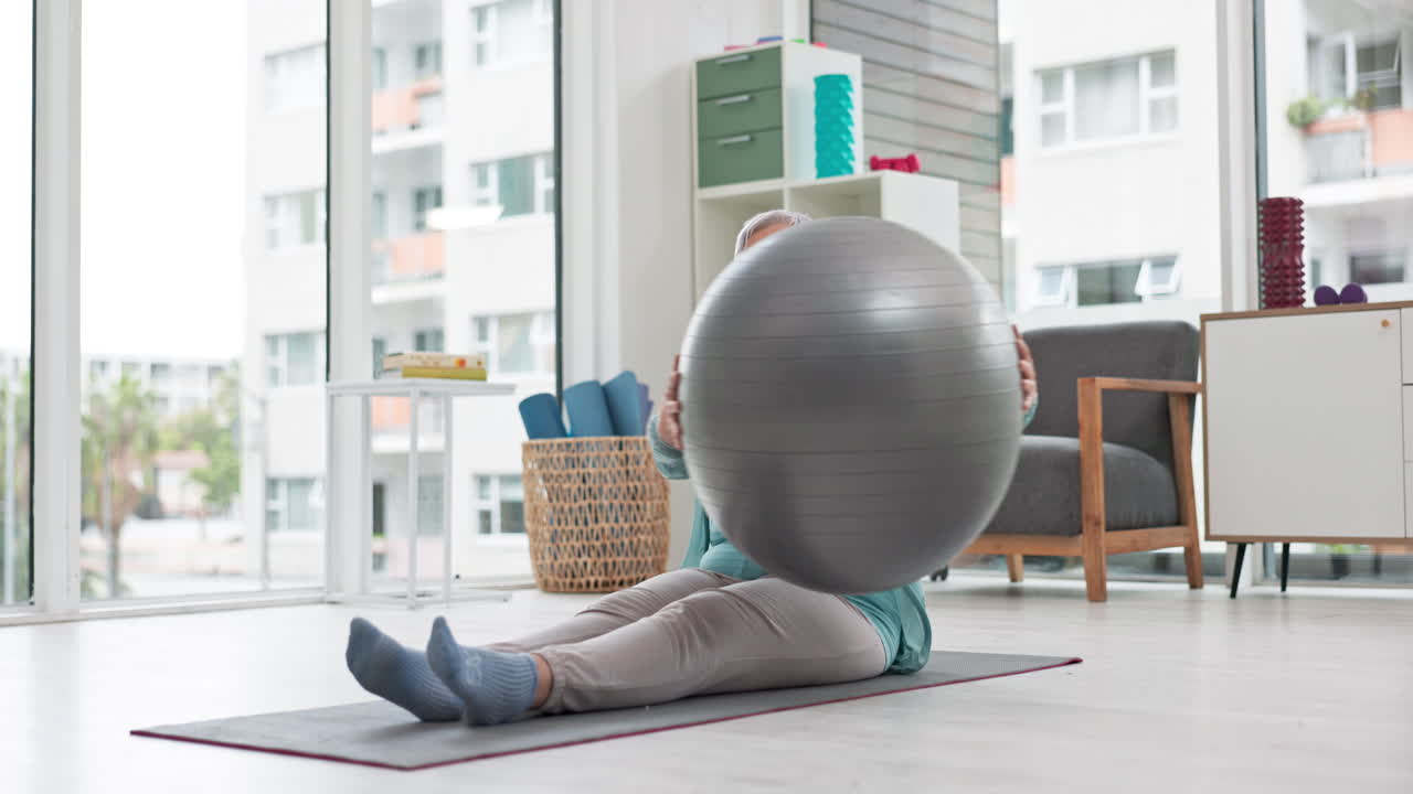 Senior woman, exercise and ball at home