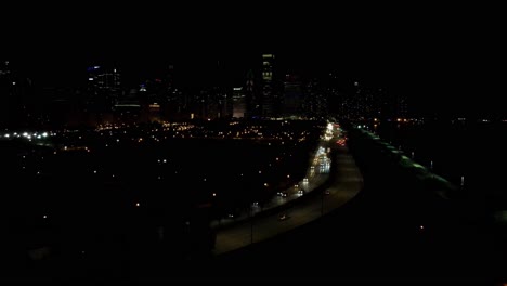 chicago illinois at night, traffic cars passing aerial footage