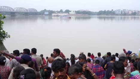 on the eve of durga puja, hindus gather at ganges for bathing and tarpan on mahalaya day.