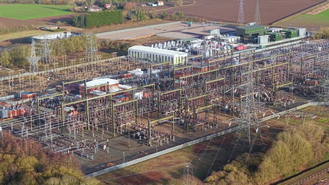 High angle drone view showcasing modern synchronous condenser units and energy balancing infrastructure at Walpole