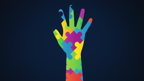 animation of multi coloured puzzle elements forming hand, symbol of autism awareness month symbol