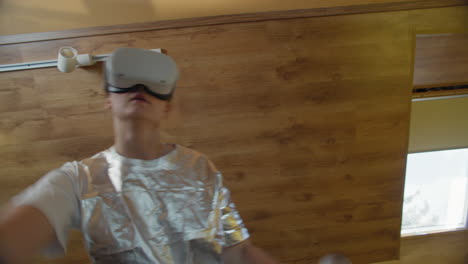 interactive vr gaming by woman in silver outfit