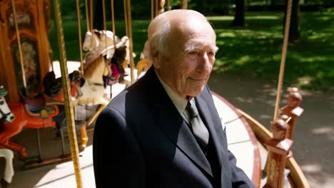 senior man at a carousel