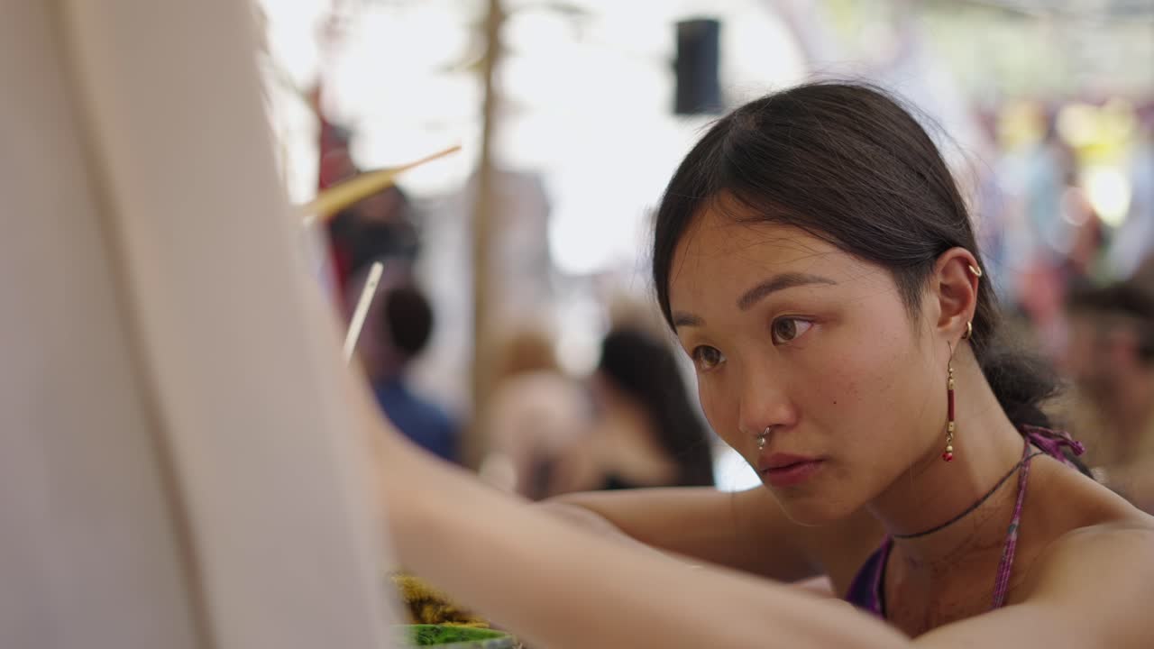 Close-up portrait of a concentrated young woman