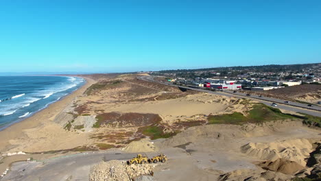 aerial drone view of sand city monterey california on highway 1 and the ocean shot in 4k high resolution