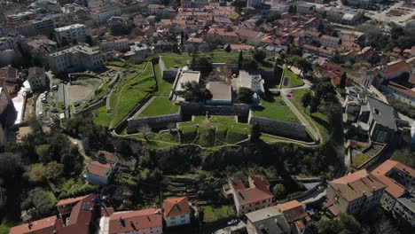 Drone-pull-out-of-ancient-roman-ruins-in-pula,-Croatia,-old-roman-forum-and-city-center