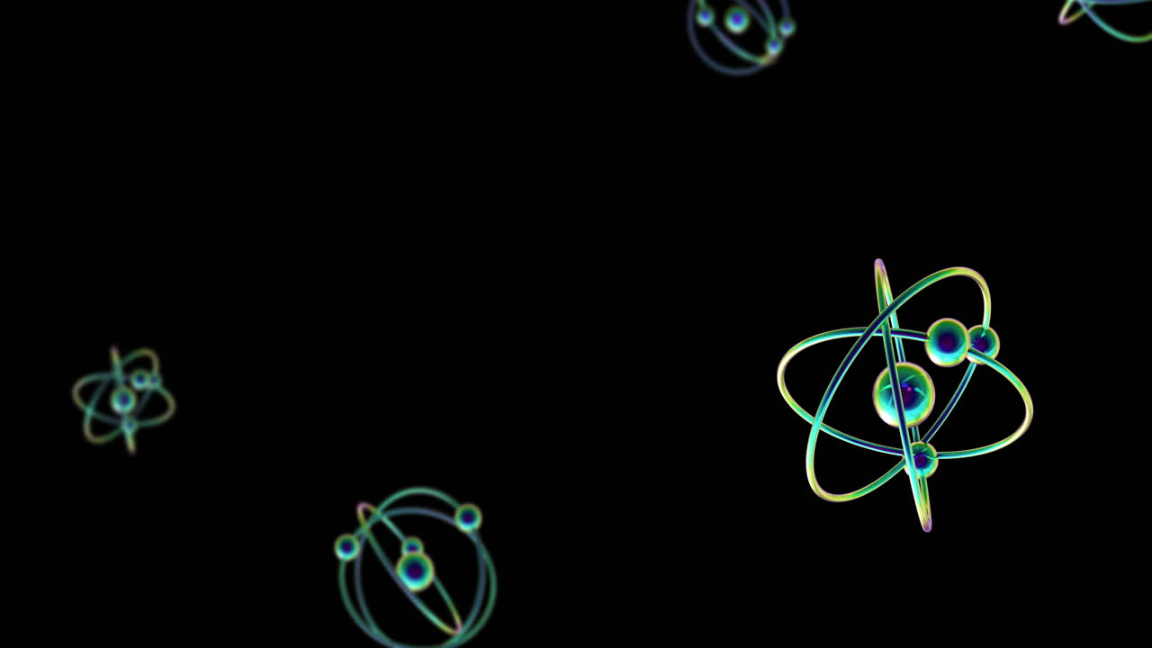 Animation of atom models spinning on black background